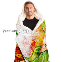 Load image into Gallery viewer, a man is wearing the Autumn Fairy Cats Hooded Blanket with premium sherpa lining, featuring art of a white/orange  cat, and black/blue cat, each with leaf wings
