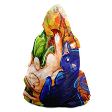 Load image into Gallery viewer, a man is wearing the Autumn Fairy Cats Hooded Blanket, featuring art of a white/orange cat, and black/blue cat, each with leaf wings
