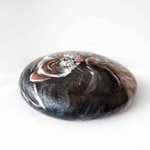 Load image into Gallery viewer, a small beach stone, hand painted with a portrait of a smiling ferret with its tongue out
