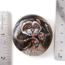 Load image into Gallery viewer, a small beach stone, hand painted with a portrait of a smiling ferret with its tongue out
