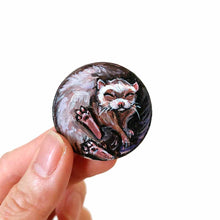 Load image into Gallery viewer, a ferret sleeping, hand painted on a circle wood disc, available as a keepsake or pendant necklace
