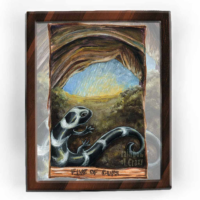 An art print of the five of cups card, from the animism tarot: a marbled salamander hides in a cave as the rain falls and the sun slowly rises