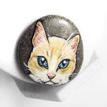 Load image into Gallery viewer, Rock art featuring a portrait of a flame point siamese cat with orange and white fur and grey blue eyes
