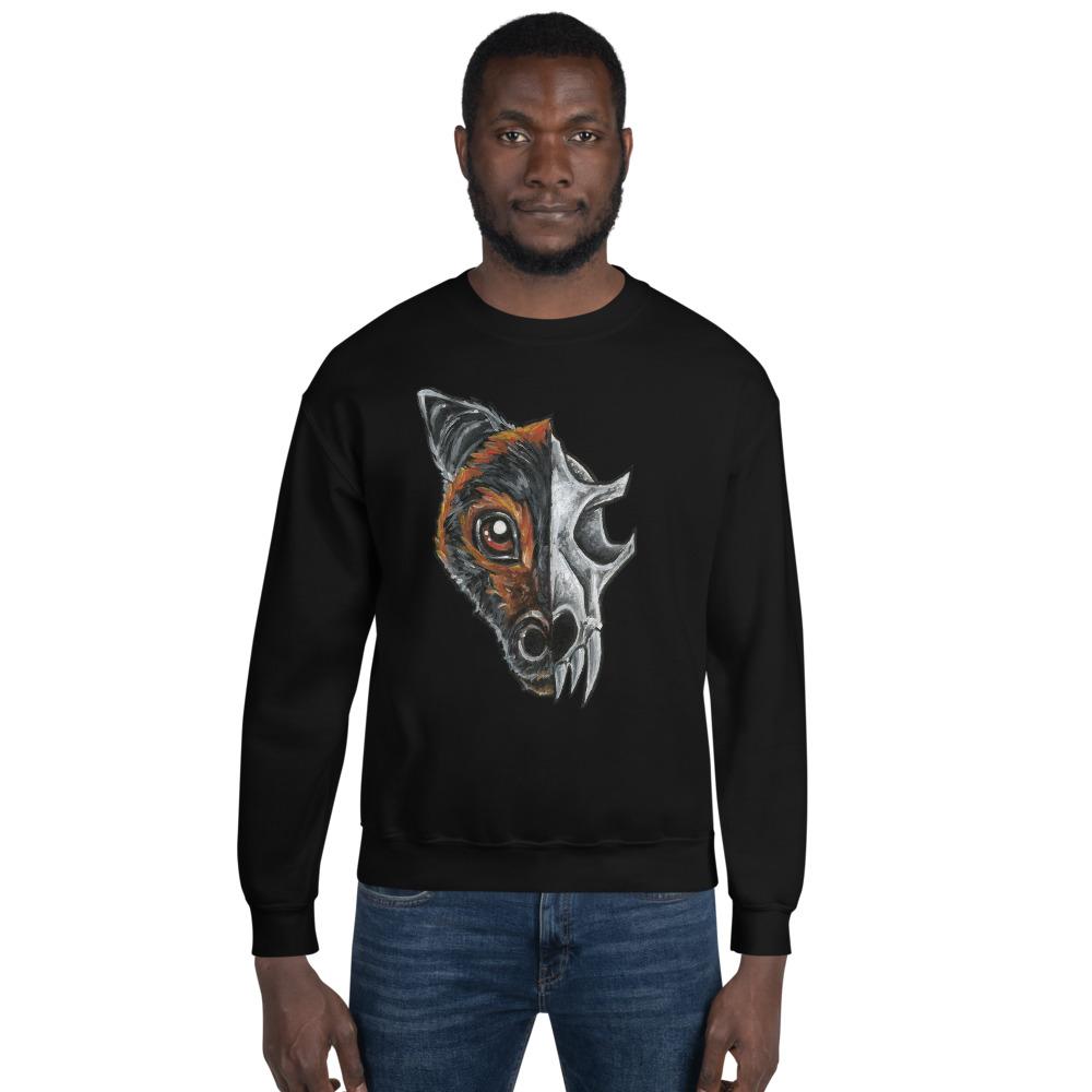 A man is wearing a unisex sweatshirt in the colour black, which is printed with a split graphic: the left side features the face of a flying fox bat, and the right side features an evil looking bat skull
