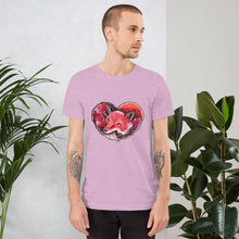 Load image into Gallery viewer, A man is wearing the Fox Love Premium Unisex T-shirt in the colour heather prism lilac, which includes art of a red fox sleeping in the shape of a heart.

