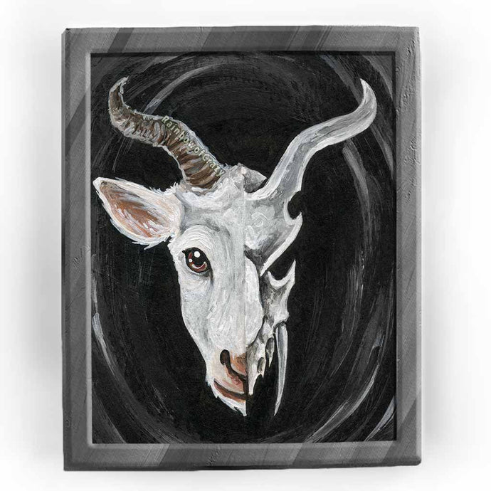 an aceo features a split image: a white horned goat's head on the left side, and a darker, stylized goat skull on the right