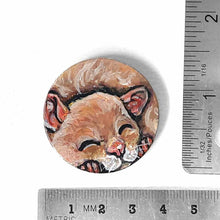 Load image into Gallery viewer, a smooth wood circle, hand painted with a sleeping hamster. available as a keepsake or pendant necklace
