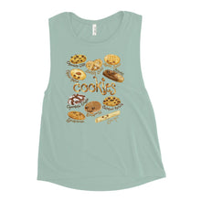 Load image into Gallery viewer, A women&#39;s muscle tank top, in the colour dusty blue, printed with artwork of 10 types of cookies with smiley faces
