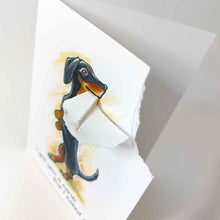 Load image into Gallery viewer, a greeting card featuring an illustration of a dachshund standing on its hind legs. the top right corner of the card is ripped off and hangs from the dog&#39;s mouth. the card reads, I got you a card! .. but I eated it
