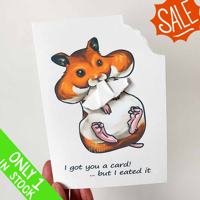 A greeting card featuring art of a Syrian hamster with big, full cheeks, with the text, 