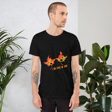 Load image into Gallery viewer, A man wearing the I Believe in You Leaf Premium Unisex T-Shirt in the colour heather black, which includes art of two maple leaves and the words, &quot;I be-leaf in you&quot;
