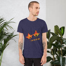 Load image into Gallery viewer, A man wearing the I Believe in You Leaf Premium Unisex T-Shirt in the colour heather midnight navy blue, which includes a graphic of two maple leaves and the words, &quot;I be-leaf in you&quot;
