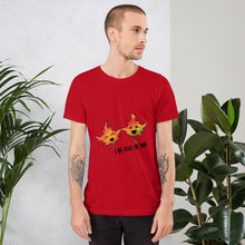 Load image into Gallery viewer, A man wearing the I Believe in You Leaf Premium Unisex T-Shirt in the colour red, which includes a graphic of two maple leaves and the words, &quot;I be-leaf in you&quot;
