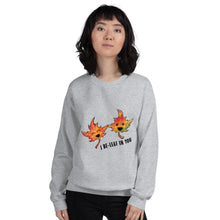 Load image into Gallery viewer, A woman is wearing a unisex sweatshirt in the colour sport grey, featuring a graphic of two smiling maple leaves with the words, &quot;I Be-Leaf In You&quot;
