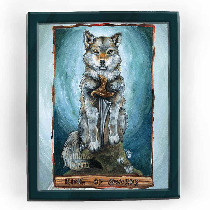 An art print of the King of Swords from the Animism Tarot. It features a grey wolf sitting on the top of a cliff, with a sword set in front of him.