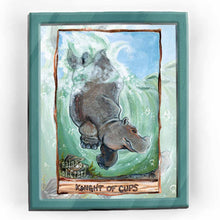 Load image into Gallery viewer,  an art print of the knight of cups, from the Animism tarot: a hippopotamus dives into the water, swimming past an open oyster.
