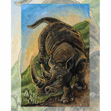 Load image into Gallery viewer, Art print of the knight of pentacles card, from the Animism tarot: a black rhinoceros comes down from a hill. 
