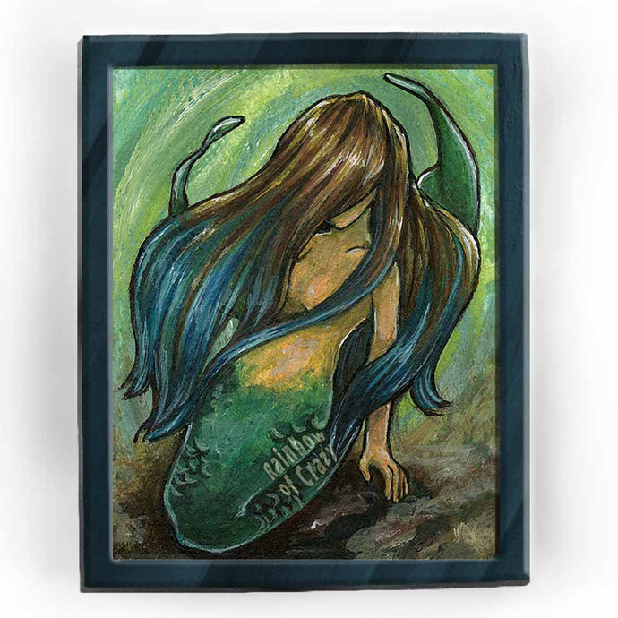 an art print featuring an illustration of a mermaid, faced hidden by her brown and blue hair