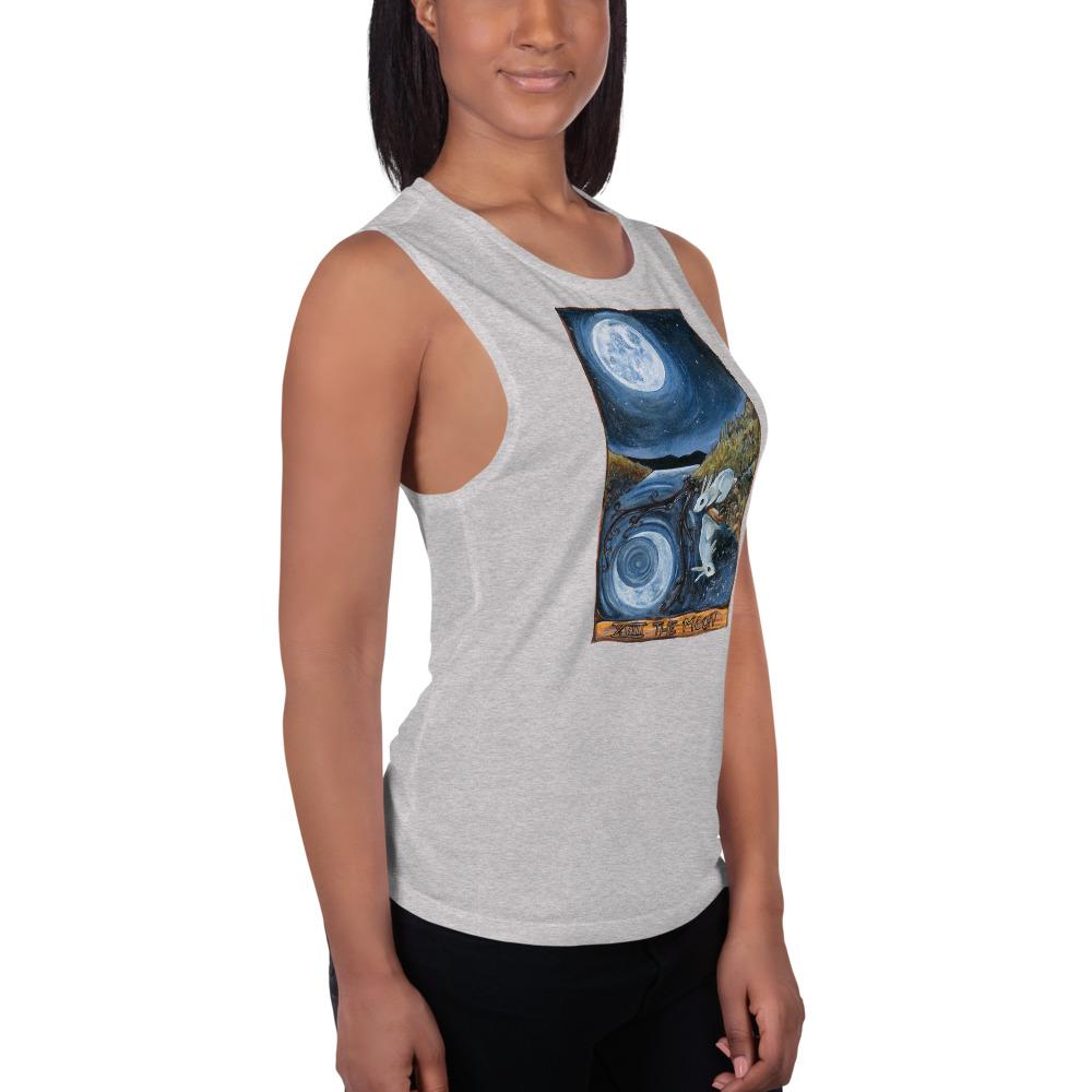 A woman is wearing the Women's Muscle Tank Top, in the colour athletic heather grey, which is printed with an illustration of The Moon tarot card from the Animism Tarot