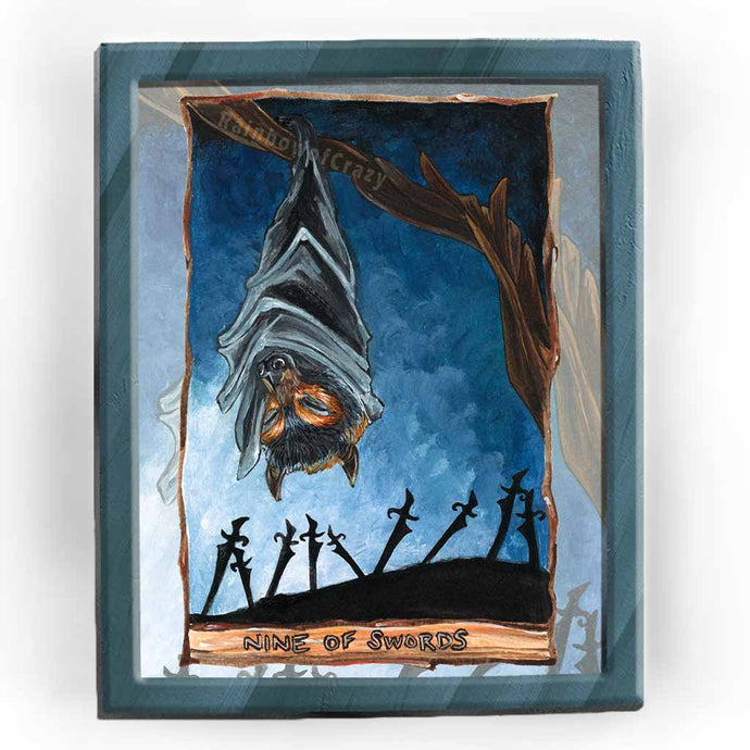 An art print of the Nine of Swords card from the Animism Tarot. It features a flying fox bat hanging from a tree at night, while nine swords stand below.