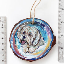 Load image into Gallery viewer, A wood Christmas ornament featuring a portrait of a white Havanese dog in front of a snowy background, next to two rulers to show its size: 3 1/16 x 3 3/8 inches or 7.8 x 8.5 cm
