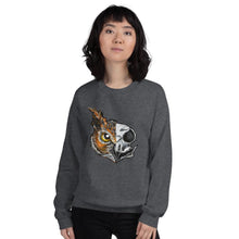 Load image into Gallery viewer, A woman wears a unisex sweatshirt in the colour dark heather grey, printed with art of a split image: the left side features an owl&#39;s face, and the right side features an evil looking owl skull.
