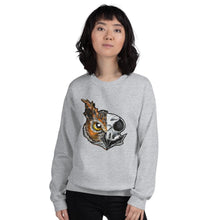 Load image into Gallery viewer, A woman wears a unisex sweatshirt in the colour sport grey, printed with artwork of a split image: the left side features an owl&#39;s face, and the right side features an evil looking owl skull.
