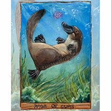 Load image into Gallery viewer, an art print of the page of cups tarot card, from the animism tarot deck: a platypus swims in the ocean, playing with a purple lotus flower, with seaweed swaying below
