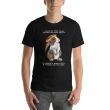 Load image into Gallery viewer, A man wears a unisex t-shirt in the colour black heather, which features art of a bunny rabbit with a pancake on its head. The shirt reads, &quot;I have no idea what you&#39;re talking about / So here&#39;s a bunny with a pancake on its head&quot;
