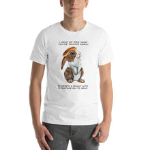 Load image into Gallery viewer, A man wears a unisex t-shirt in the colour white, which features an illustration of a bunny rabbit with a pancake on its head. The shirt reads, &quot;I have no idea what you&#39;re talking about / So here&#39;s a bunny with a pancake on its head&quot;
