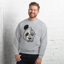 Load image into Gallery viewer, A man wears a unisex sweatshirt in the colour sport grey, printed with artwork of a split image: the left side features an panda&#39;s face, and the right side features an evil looking panda skull.

