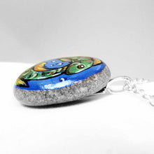 Load image into Gallery viewer, necklace featuring a painting of two green fish, swimming in the shape of a circle, representing the sign of pisces
