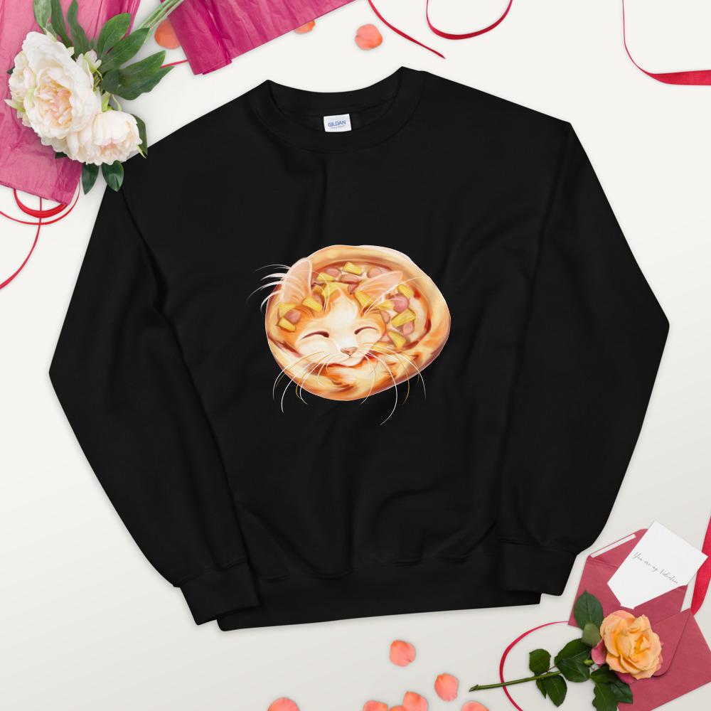 A unisex sweatshirt in the colour black, printed with artwork of an orange cat as a pineapple pizza, topped with pineapple and ham.