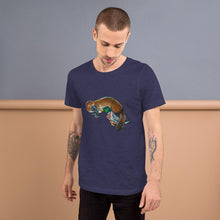 Load image into Gallery viewer, A man is wearing the Platypus Duck Premium T-Shirt in the colour heather navy blue, which includes a print of platypus kissing a mallard duck
