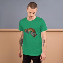 Load image into Gallery viewer, A man is wearing the Platypus Duck Premium T-Shirt in the colour kelly green, which is printed with art of platypus kissing a mallard duck
