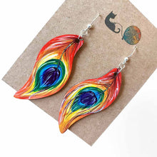 Load image into Gallery viewer, large, leaf shaped, wood fish hook earrings, hand painted with peacock feathers in rainbow colours
