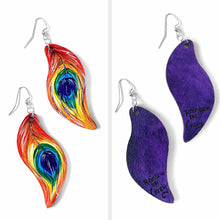 Load image into Gallery viewer, large, leaf shaped, wood fish hook earrings, hand painted with peacock feathers in rainbow colours: red on top, purple in the center, and purple on the back
