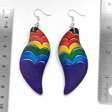 Load image into Gallery viewer, large, long, leaf shaped, wood fish hook earrings, hand painted with a purple heart in front and hearts in rainbow colours rising above
