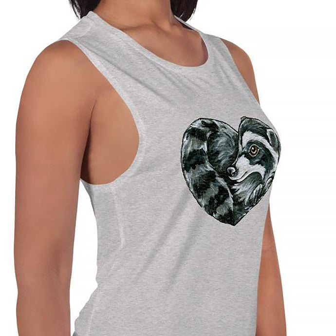 A woman is wearing the Raccoon Love Women's Muscle Tank Top, in the colour athletic heather grey, which is printed with a graphic of a raccoon forming the shape of a heart.
