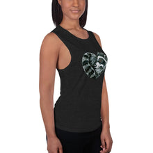 Load image into Gallery viewer, A woman is wearing the Raccoon Love Women&#39;s Muscle Tank Top, in the colour black heather, which is printed with an illustration of a raccoon forming the shape of a heart.
