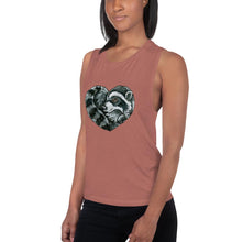 Load image into Gallery viewer, A woman is wearing the Raccoon Love Women&#39;s Muscle Tank Top, in the colour mauve, which is printed with artwork of a raccoon forming the shape of a heart.
