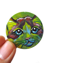 Load image into Gallery viewer, A wood pendant painted with the face of a Ragdoll cat. Available as a wood keepsake or necklace.
