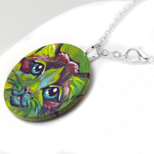 Load image into Gallery viewer, A wood pendant painted with the face of a Ragdoll cat. Available as a wood keepsake or necklace.
