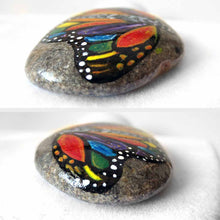 Load image into Gallery viewer, This small rock art features a butterfly painted with all the colours of the rainbow
