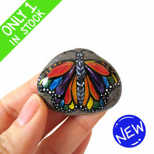 Load image into Gallery viewer, This small rock art features a butterfly painted with all the colours of the rainbow
