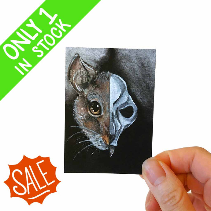 ACEO art print features a split image of a brown rat's face on on the left side, and its slightly scary, stylized rat skull on the other.