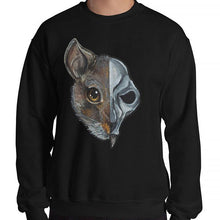 Load image into Gallery viewer, A man is wearing a unisex sweatshirt in the colour black, which is printed with a split illustration: the left side features the face of a brown rat, and the right side features an evil looking rat skull
