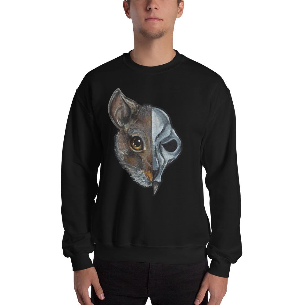 A man is wearing a unisex sweatshirt in the colour black, which is printed with a split illustration: the left side features the face of a brown rat, and the right side features an evil looking rat skull