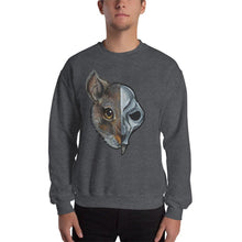 Load image into Gallery viewer, A man is wearing a unisex sweatshirt in the colour dark heather grey, which is printed with a split graphic: the left side features the face of a brown rat, and the right side features an evil looking rat skull
