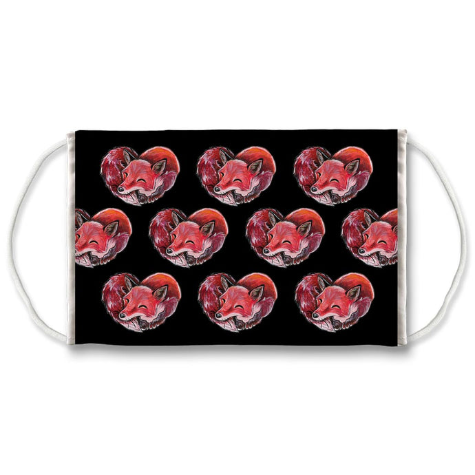A reusable face mask, patterned with art of a red fox sleeping in the shape of a heart.